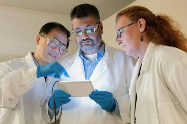 Scientists reviewing results together